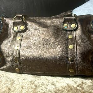 Hammit bag. Bronzy color. Good used condition. Some pen marks inside.